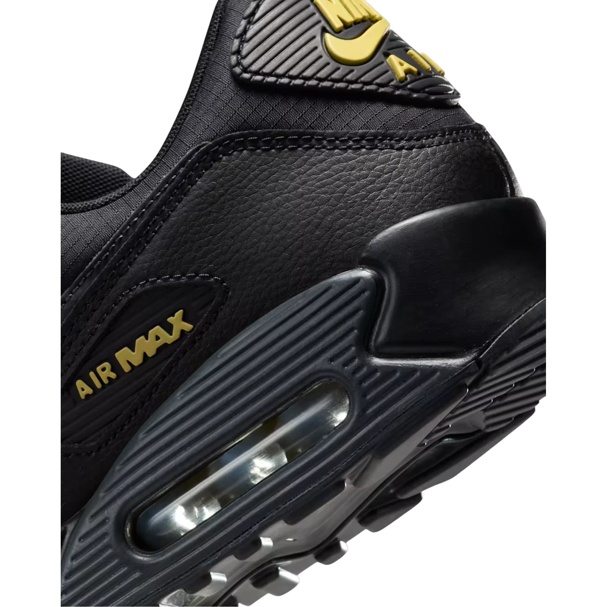 Detalle del talón de las zapatillas THE KICKS WORLD Nike Air Max 90 en negro con detalles en dorado Buff Gold