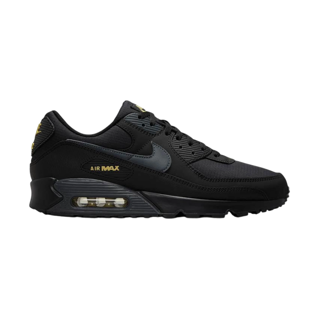 Zapatillas Nike Air Max 90 de THE KICKS WORLD en color negro con detalles en dorado, diseño urbano y unidad Air visible.