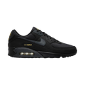 Zapatillas Nike Air Max 90 de THE KICKS WORLD en color negro con detalles en dorado, diseño urbano y unidad Air visible.